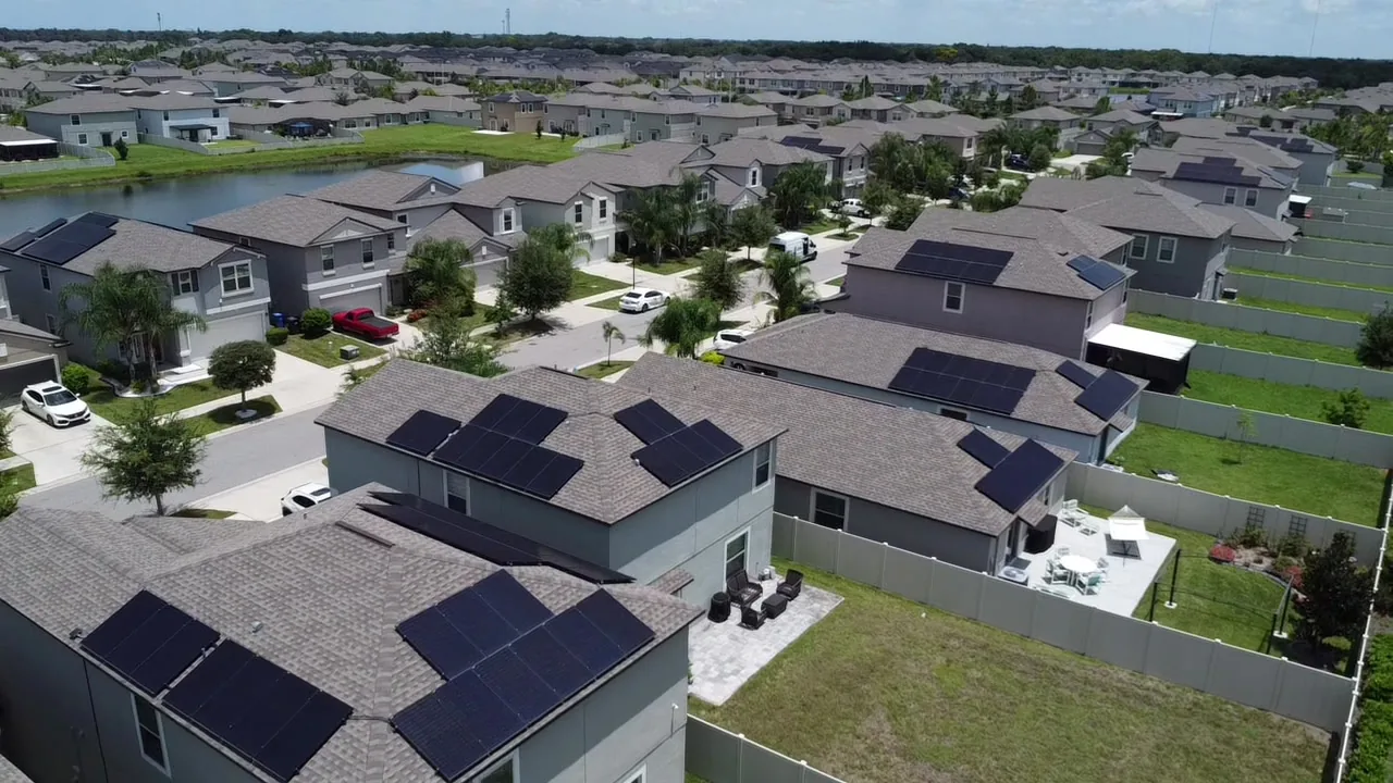 Aerial view of a Gulf Coast neighborhood with rooftop solar